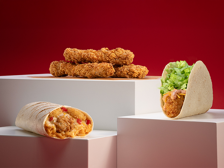 Picture of a Western Gold Grilled Burrito, Crispy Chicken Tenders, and Two Crispy Chicken Tacos